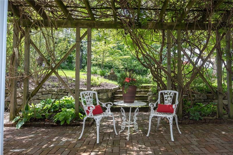 1 Old Farm Road Rosslyn Farms, PA 15106 - Photo 21 of 25 Tete a Tete seating on patio adorned with Wisteria