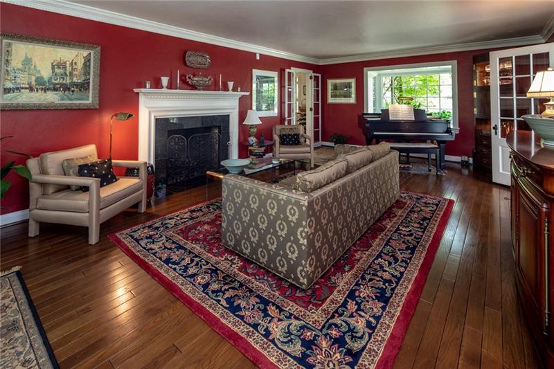 Formal living room with fireplace ... natural light ...