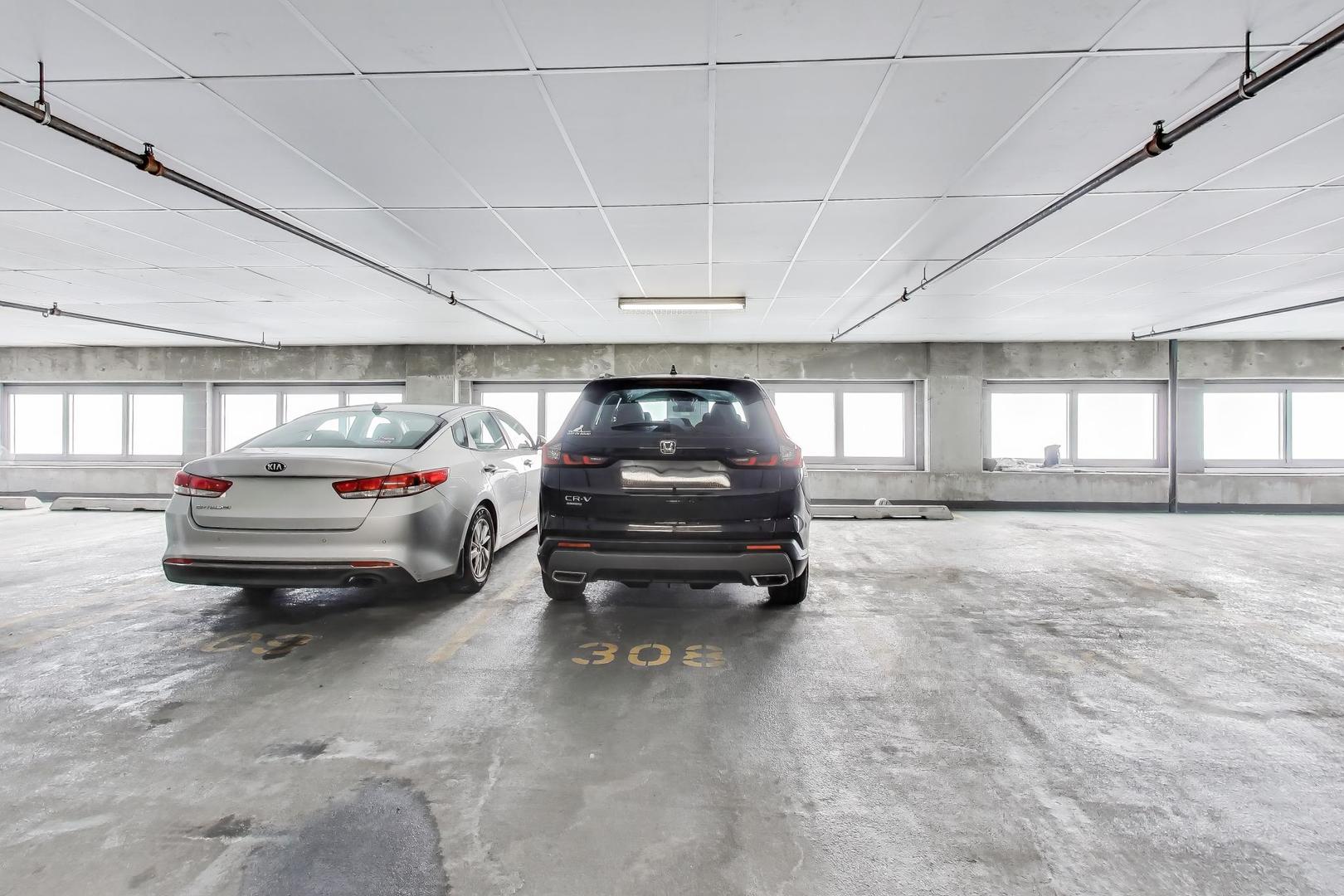 933 West Van Buren Street, Unit 504 Chicago, IL 60607 - Photo 24 of 31 a car parked in parking