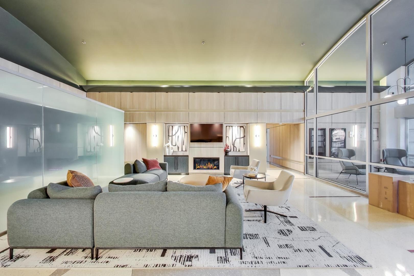 933 West Van Buren Street, Unit 504 Chicago, IL 60607 - Photo 3 of 31 a living room with furniture and a flat screen tv