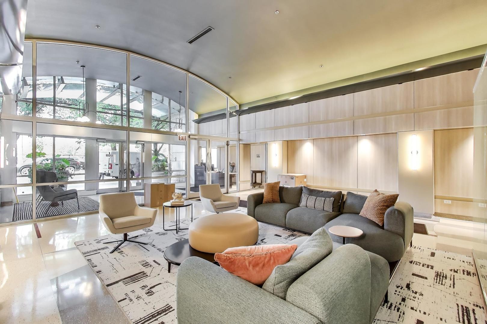 933 West Van Buren Street, Unit 504 Chicago, IL 60607 - Photo 4 of 31 a living room with furniture and a large window