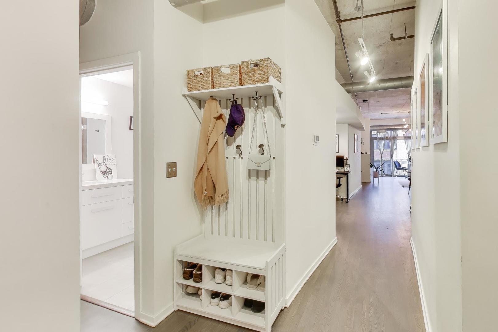 933 West Van Buren Street, Unit 504 Chicago, IL 60607 - Photo 6 of 31 a view of livingroom with furniture and wooden floor