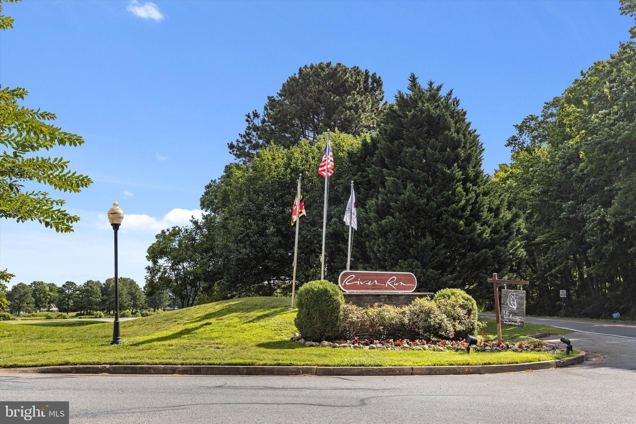 Lot #180 River Run Lane Berlin, MD 21811 - Photo 13 of 40 a front view of a house with garden