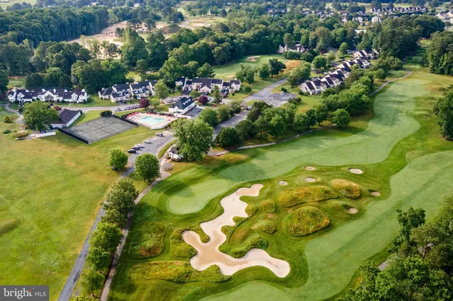 a view of a lake with a lot of trees and houses