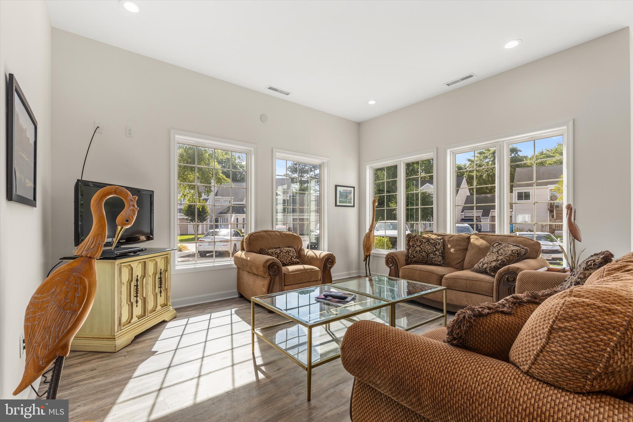 Lot #180 River Run Lane Berlin, MD 21811 - Photo 31 of 40 a living room with furniture and a floor to ceiling window