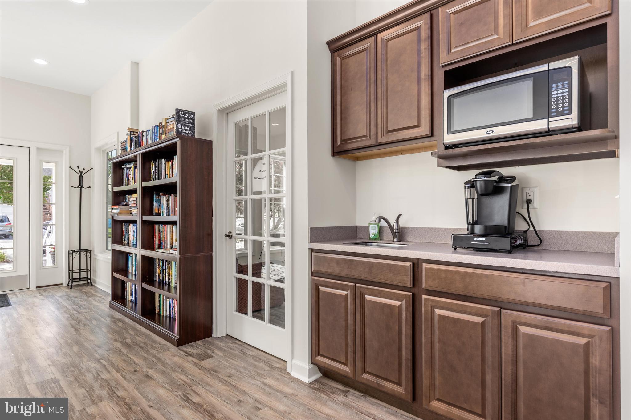 Lot #180 River Run Lane Berlin, MD 21811 - Photo 34 of 40 a kitchen with stainless steel appliances granite countertop a refrigerator and cabinets
