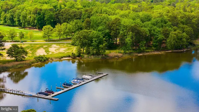 a view of a lake with houses in the back
