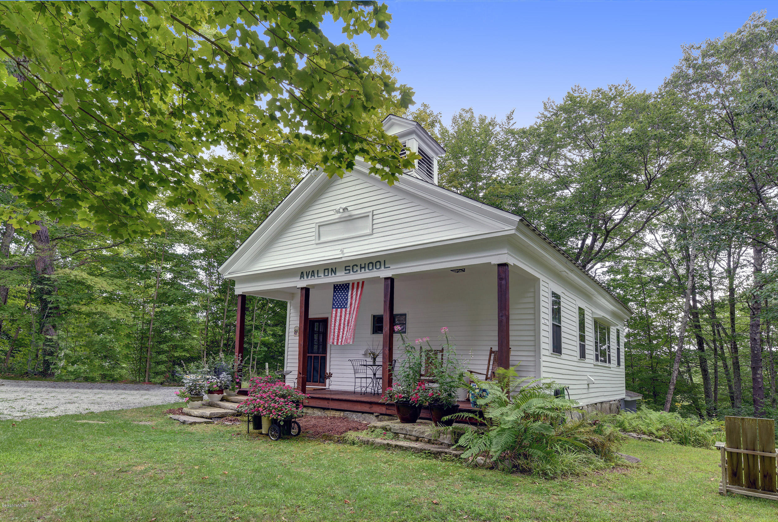 222 Main Road Monterey, MA 01245 - Photo 3 of 17 a front view of house with a garden