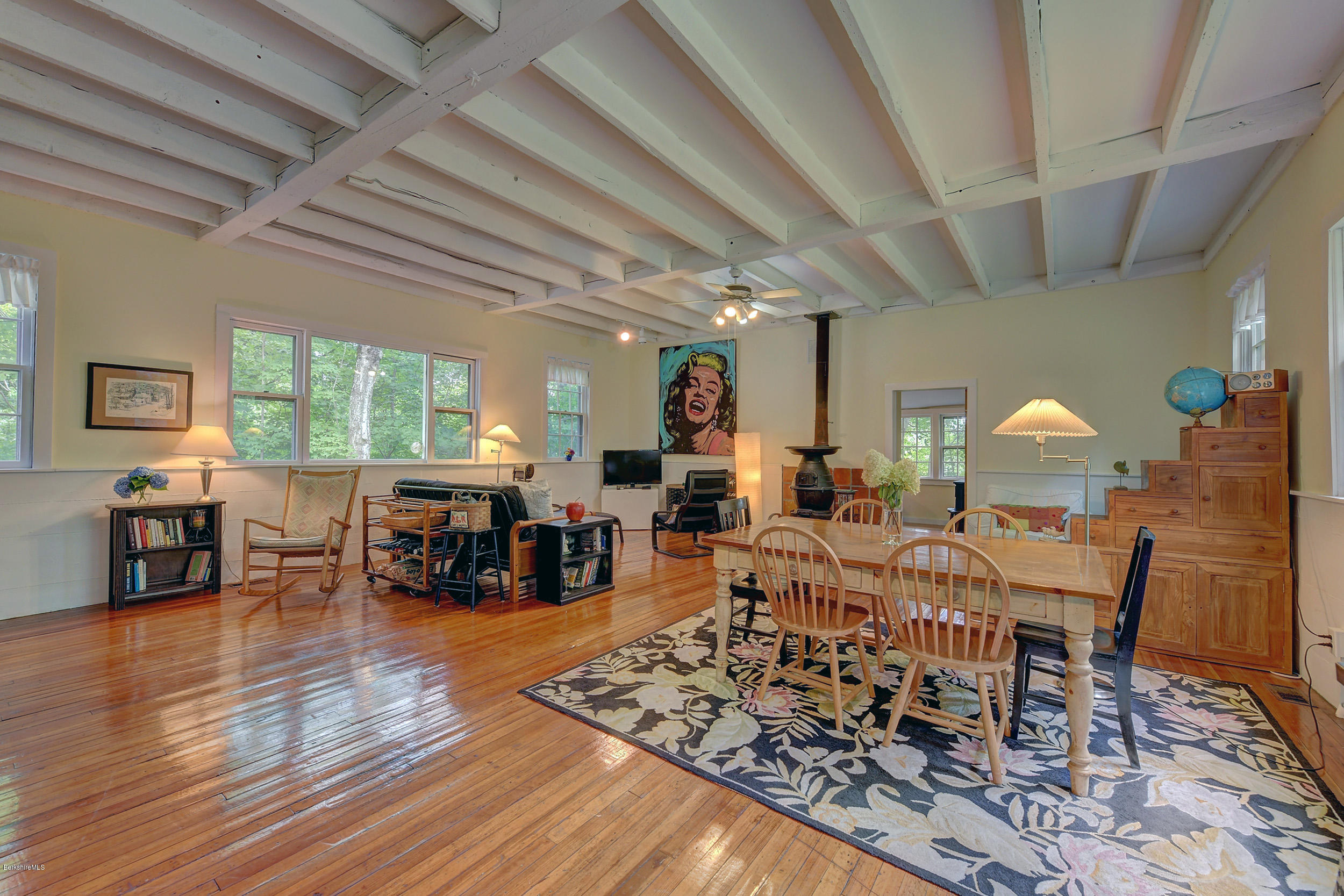 222 Main Road Monterey, MA 01245 - Photo 16 of 17 a living room with lots of furniture wooden floor and a large window