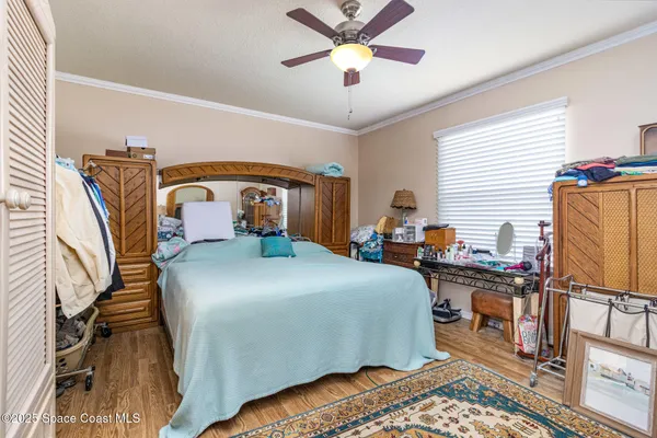 a view of a bedroom with baby bed