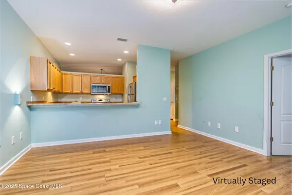 a view of kitchen with wooden floor