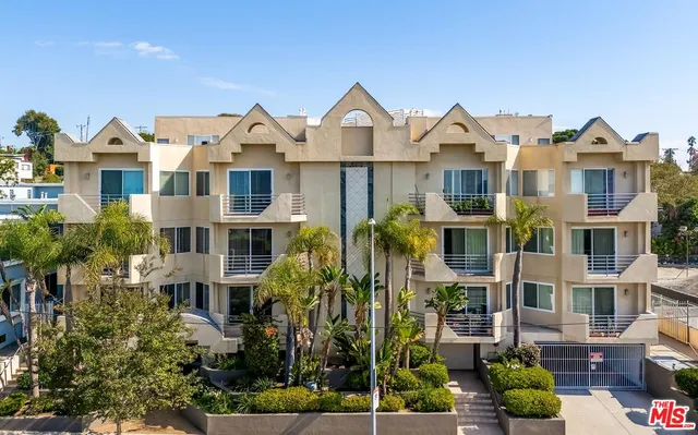 a front view of a residential houses with yard