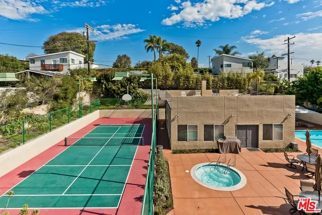 a front view of house with yard swimming pool and outdoor seating
