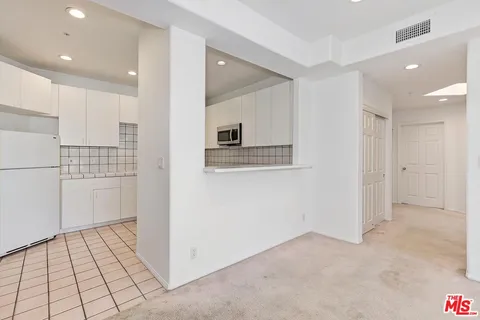 a kitchen with sink cabinets and stainless steel appliances
