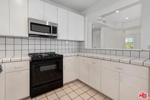 a view of storage and utility room with washer and dryer