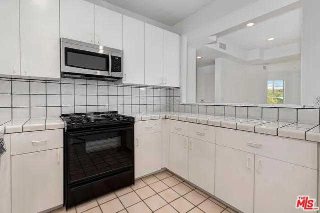 a view of storage and utility room with washer and dryer