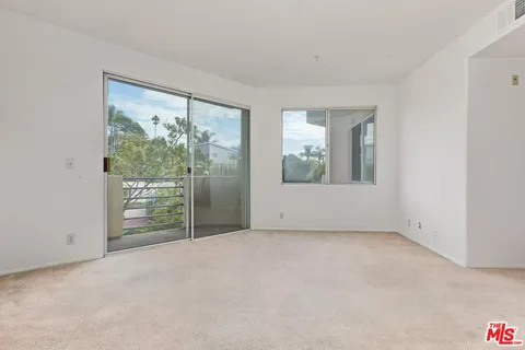 a view of swimming pool from a balcony