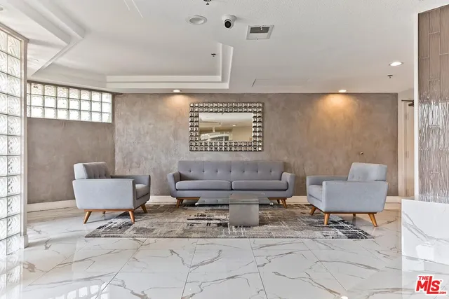 a living room with furniture and a large window