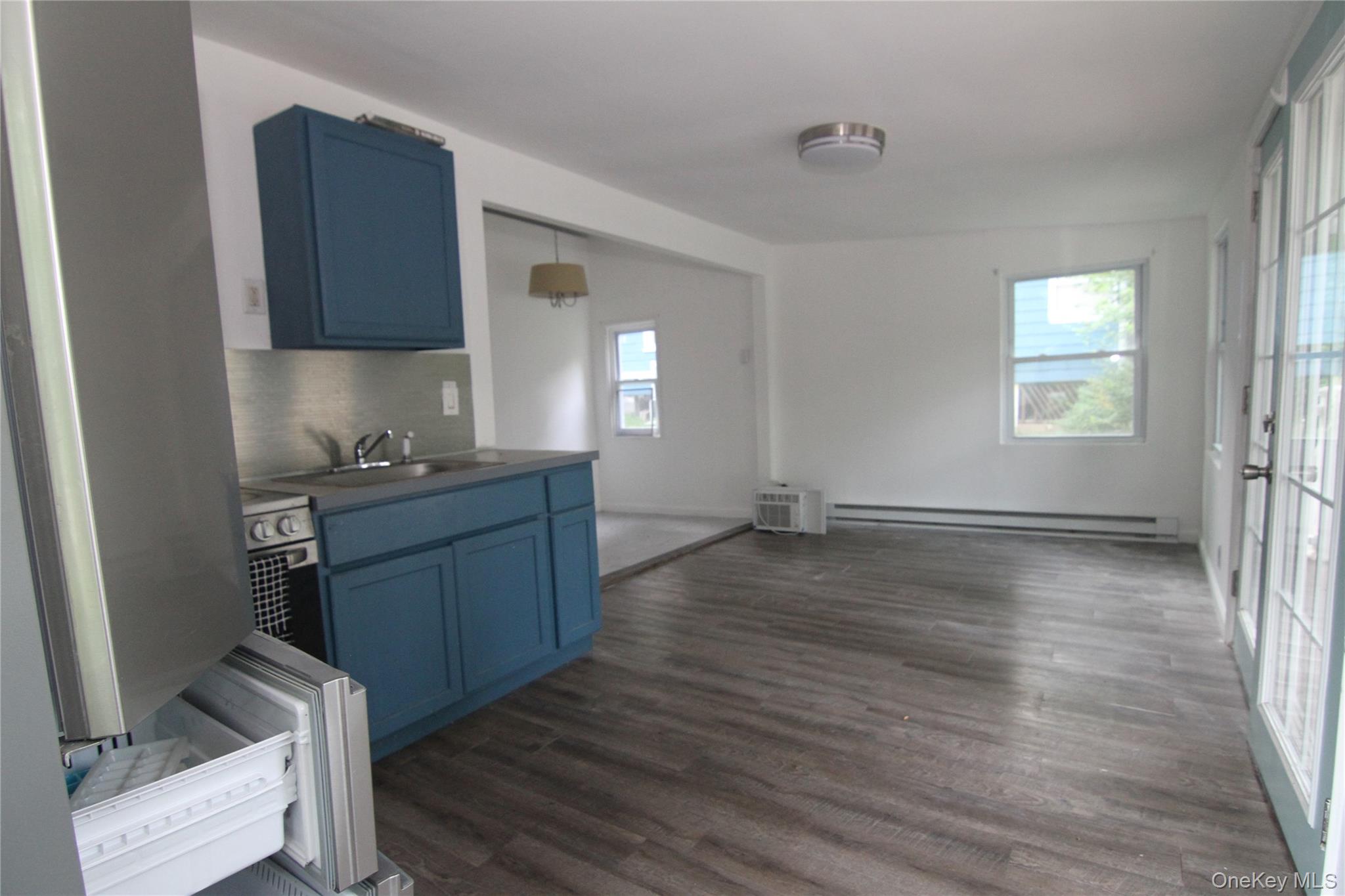 71 Miller Road, Unit 13 Hopewell Junction, NY 12533 - Photo 12 of 28 a room with wooden floors and window