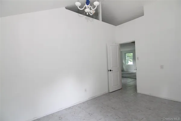 a white toilet sitting next to a window