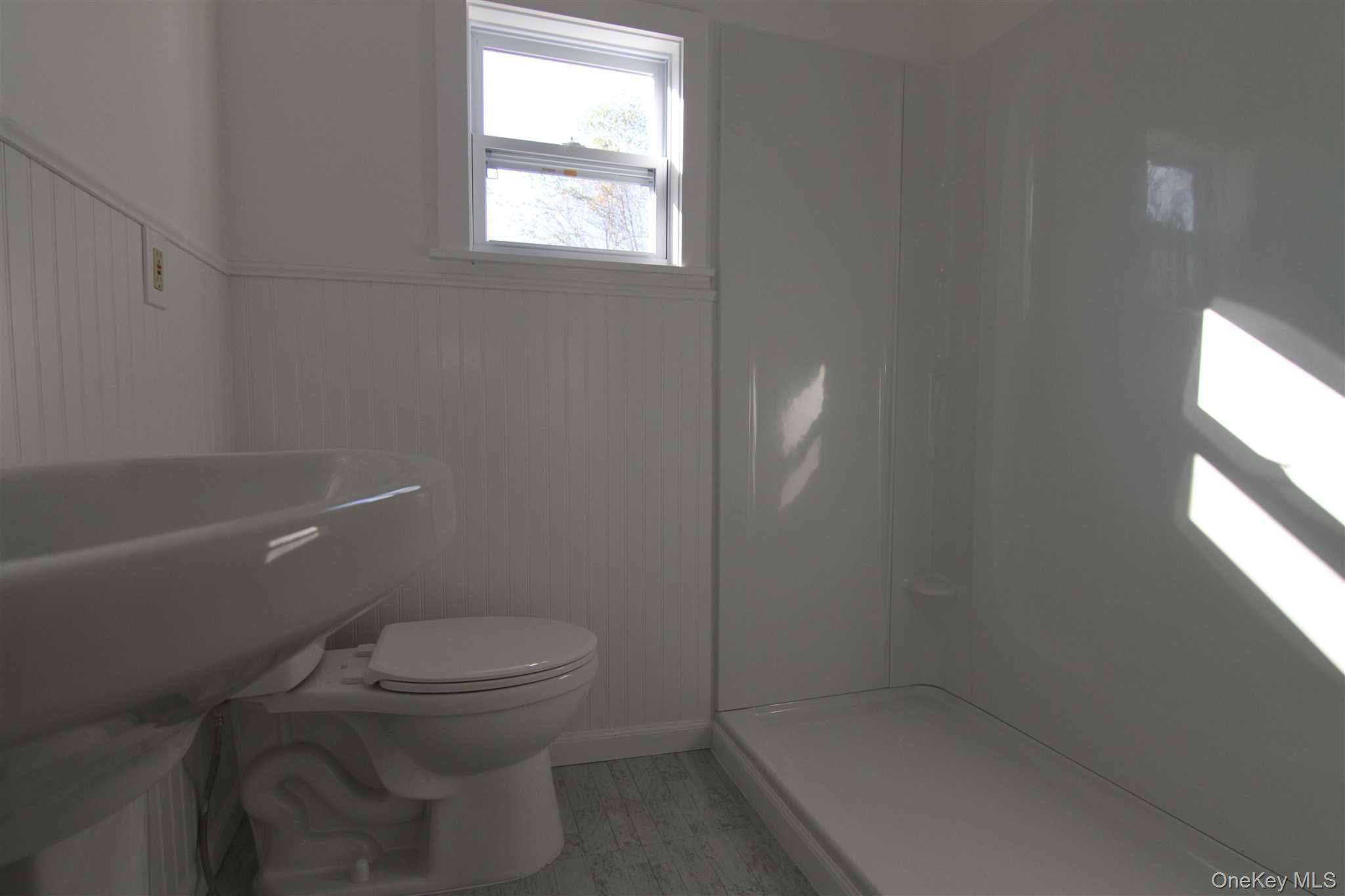 71 Miller Road, Unit 13 Hopewell Junction, NY 12533 - Photo 19 of 28 a white toilet sitting next to a window