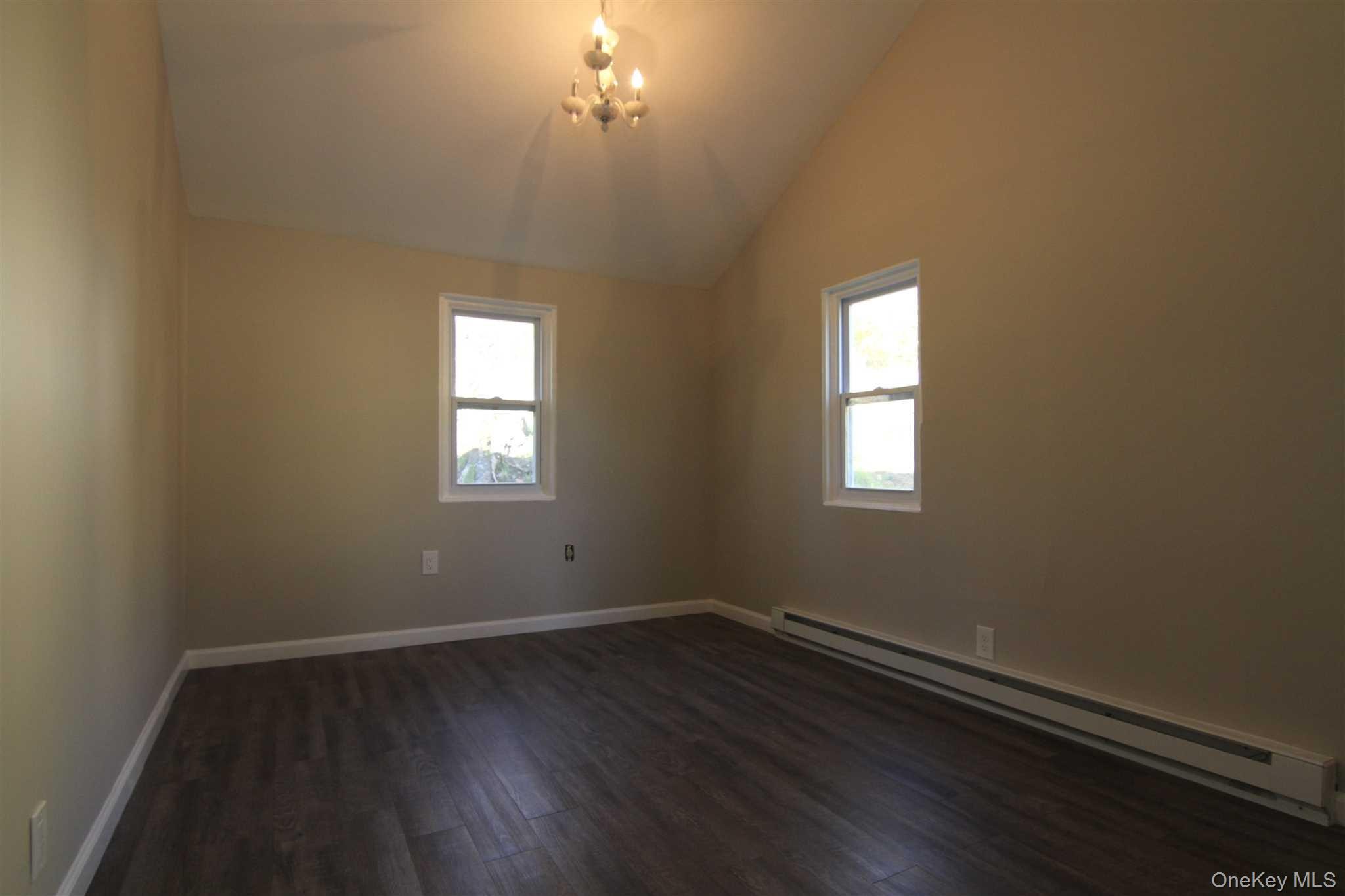 71 Miller Road, Unit 13 Hopewell Junction, NY 12533 - Photo 21 of 28 a view of a room with wooden floor and windows