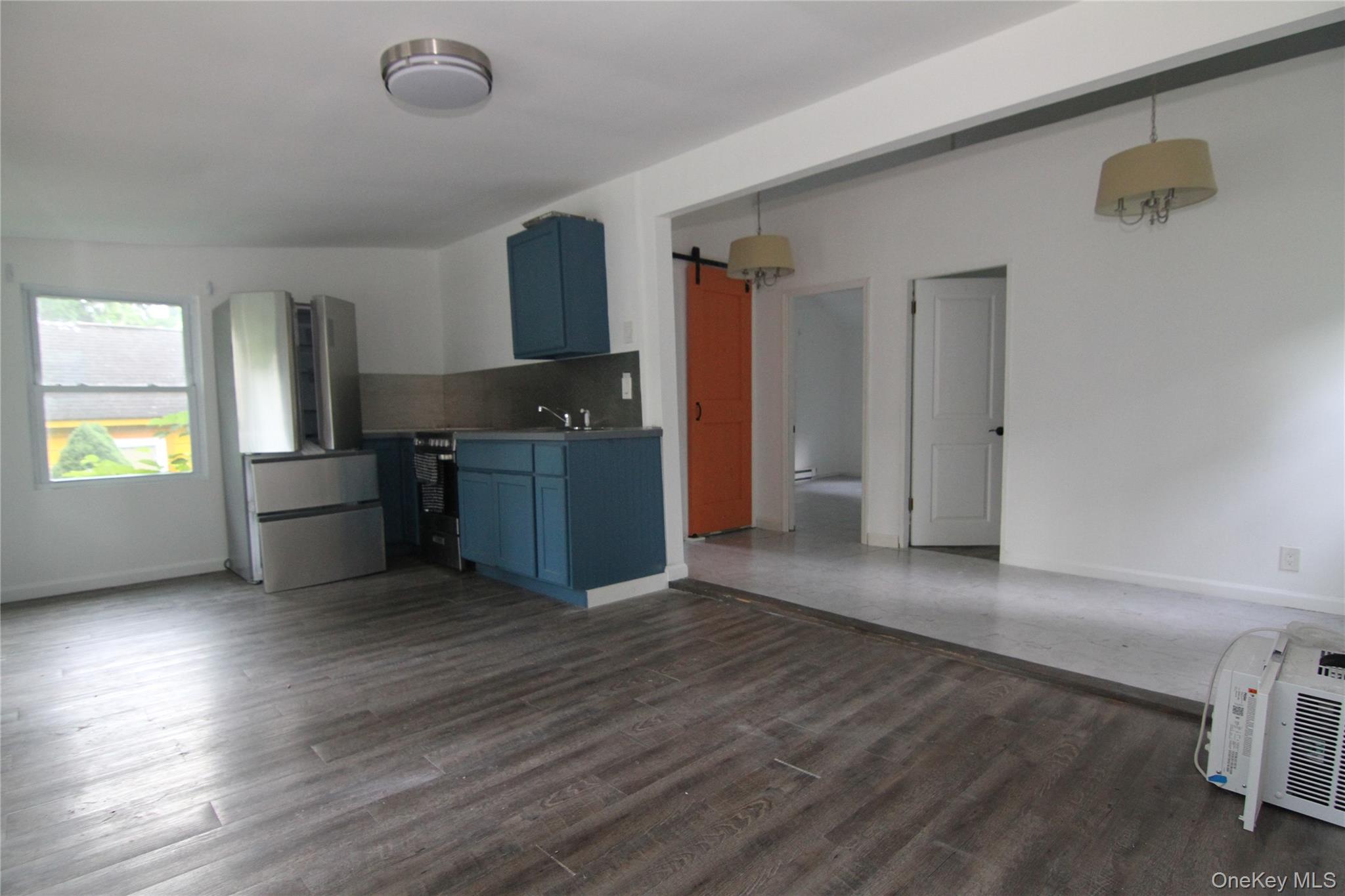 71 Miller Road, Unit 13 Hopewell Junction, NY 12533 - Photo 10 of 28 a kitchen with granite countertop a stove and a refrigerator