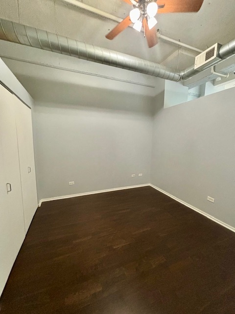 2323 West Pershing Road, Unit 222 Chicago, IL 60609 - Photo 12 of 16 a view of a room with wooden floor