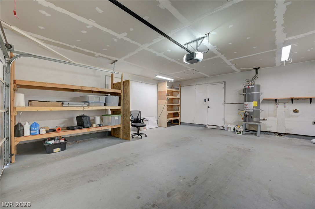 4840 Summerhill Road Las Vegas, NV 89121 - Photo 36 of 56 A spacious, well-lit garage offers ample storage with sturdy built-in shelving.