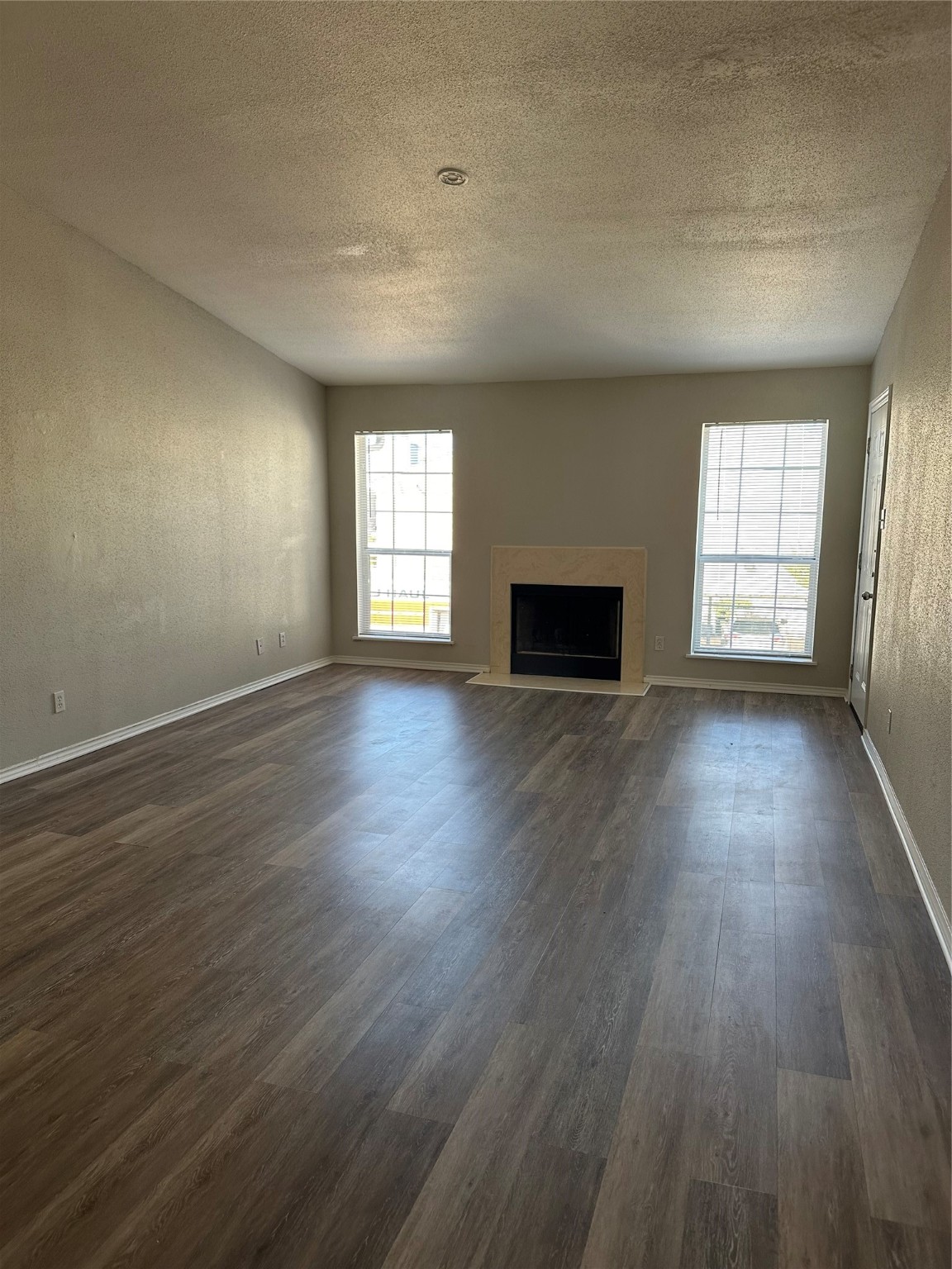6500 Sands Point Drive, Unit 404 Houston, TX 77074 - Photo 19 of 27 an empty room with wooden floor and windows