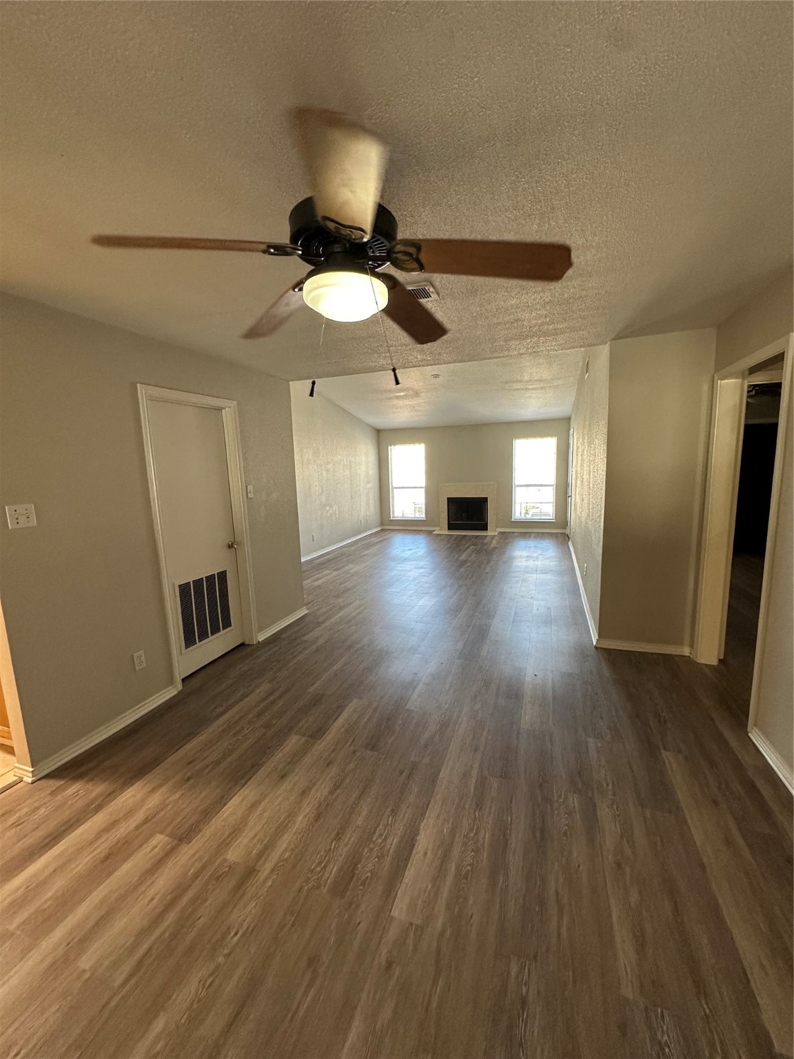 6500 Sands Point Drive, Unit 404 Houston, TX 77074 - Photo 20 of 27 a view of an empty room with wooden floor ceiling fan