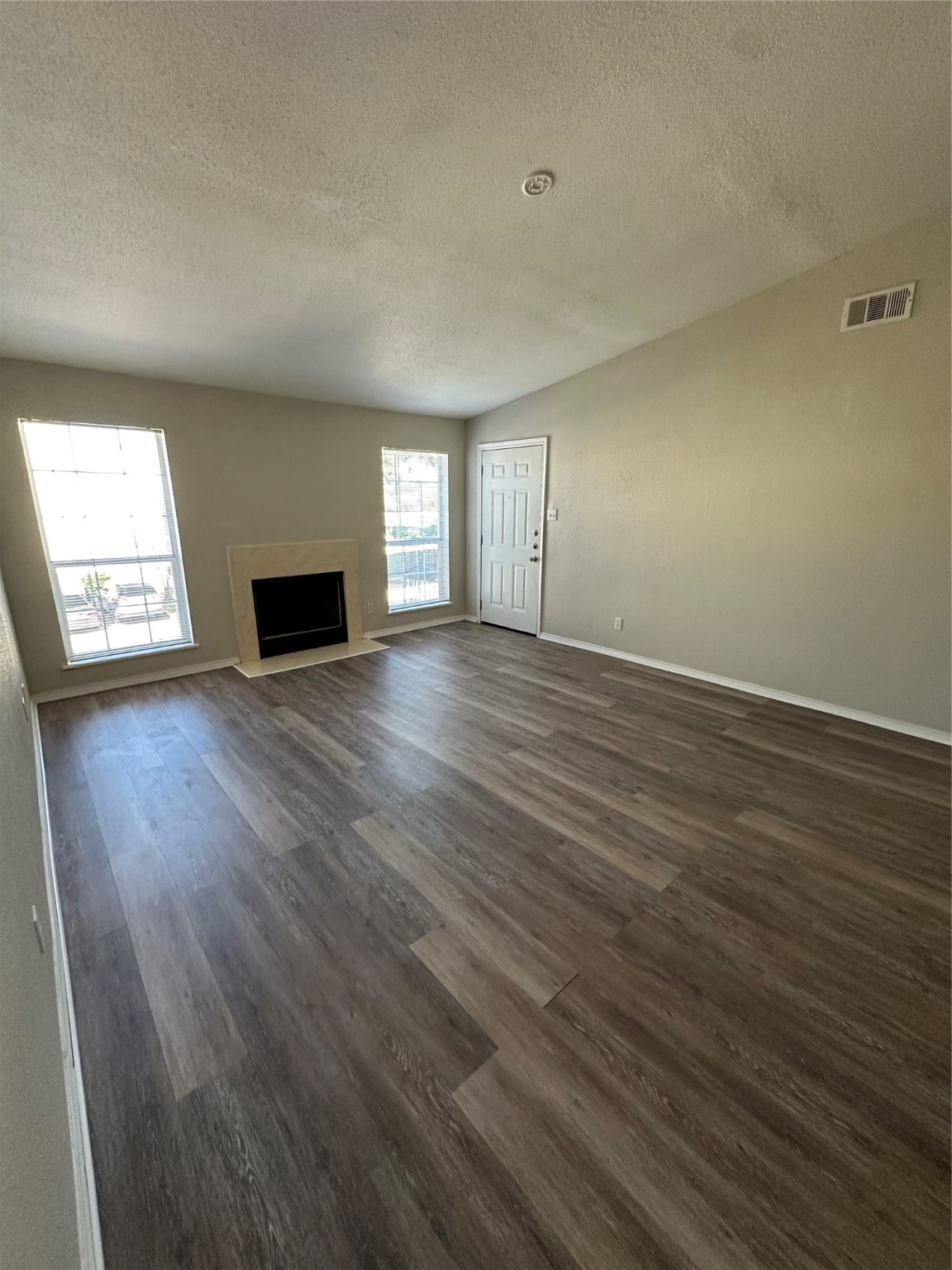 6500 Sands Point Drive, Unit 404 Houston, TX 77074 - Photo 21 of 27 an empty room with wooden floor and windows