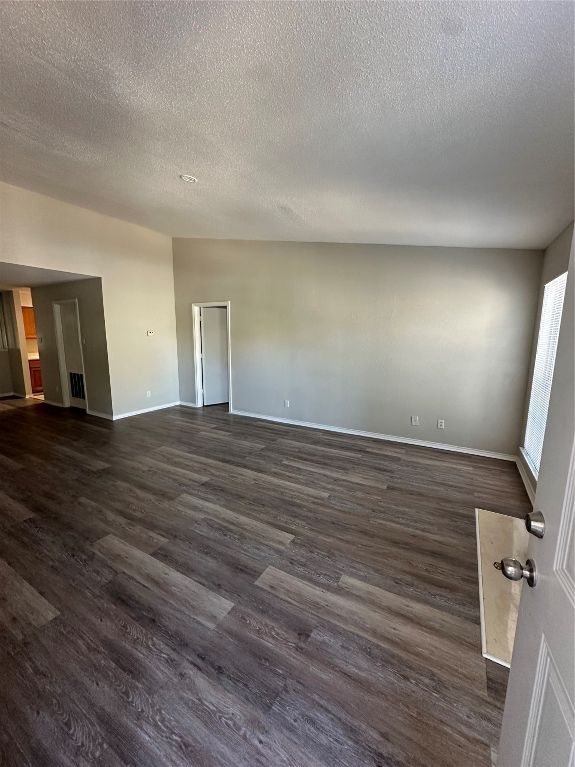 6500 Sands Point Drive, Unit 404 Houston, TX 77074 - Photo 3 of 27 a view of an empty room with wooden floor