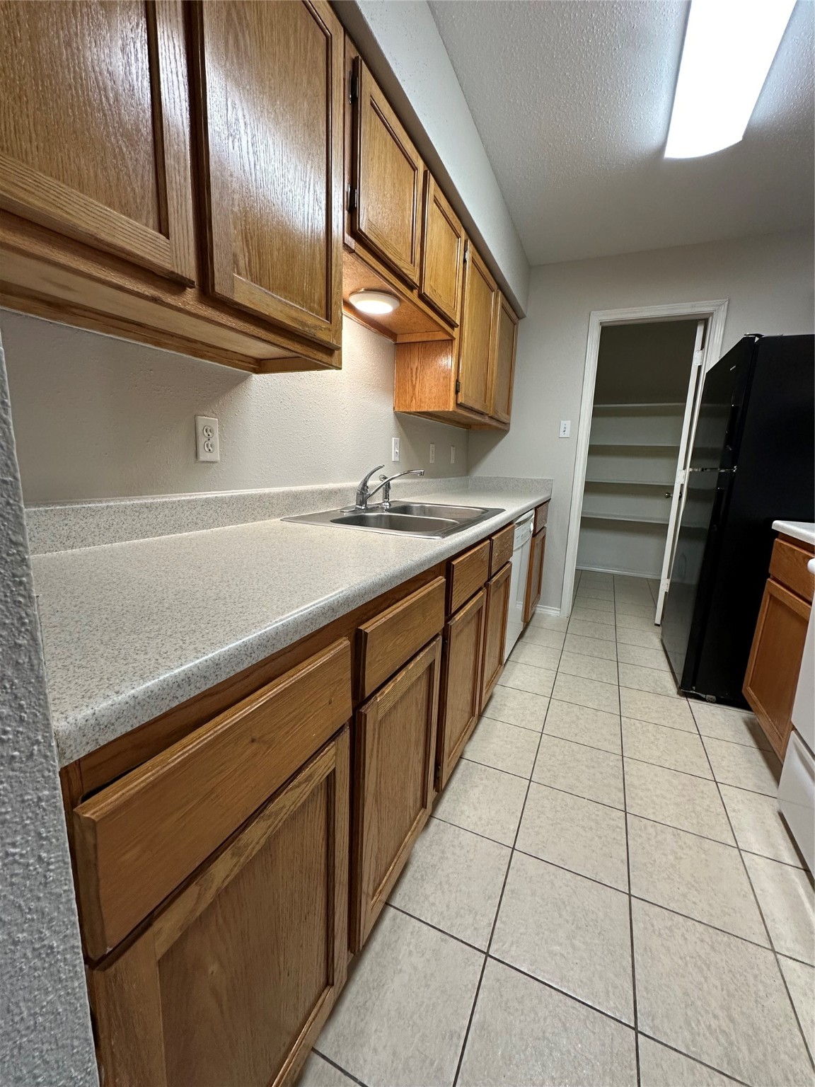 6500 Sands Point Drive, Unit 404 Houston, TX 77074 - Photo 8 of 27 a kitchen with stainless steel appliances a sink stove and cabinets