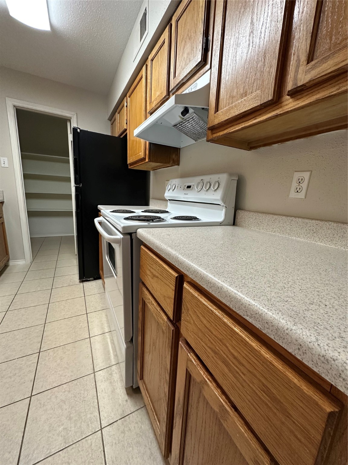 6500 Sands Point Drive, Unit 404 Houston, TX 77074 - Photo 9 of 27 a kitchen with stainless steel appliances granite countertop a refrigerator and a stove