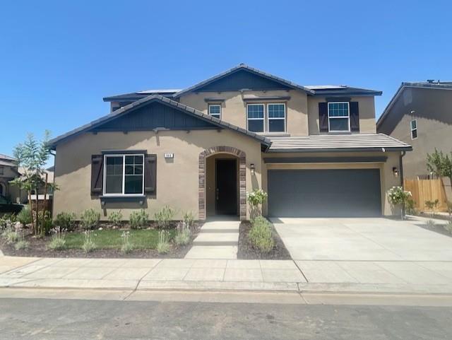 846 Huckleberry Road Madera, CA 93636 - Photo 1 of 12 a front view of a house with a yard and garage