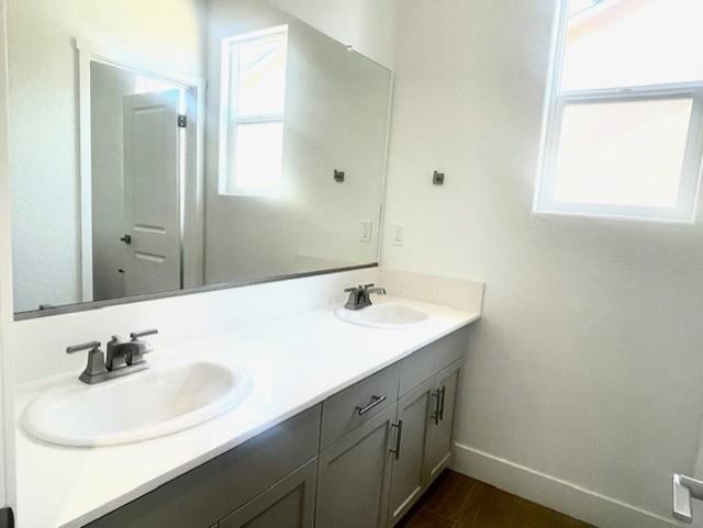 846 Huckleberry Road Madera, CA 93636 - Photo 11 of 12 a bathroom with a sink and a mirror