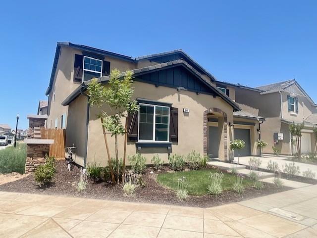 846 Huckleberry Road Madera, CA 93636 - Photo 2 of 12 a front view of a house with garden
