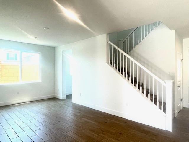 846 Huckleberry Road Madera, CA 93636 - Photo 4 of 12 a view of an empty room with wooden floor and a window