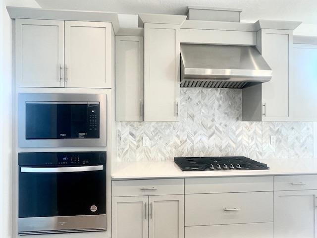 846 Huckleberry Road Madera, CA 93636 - Photo 6 of 12 a kitchen with a stove and white cabinets