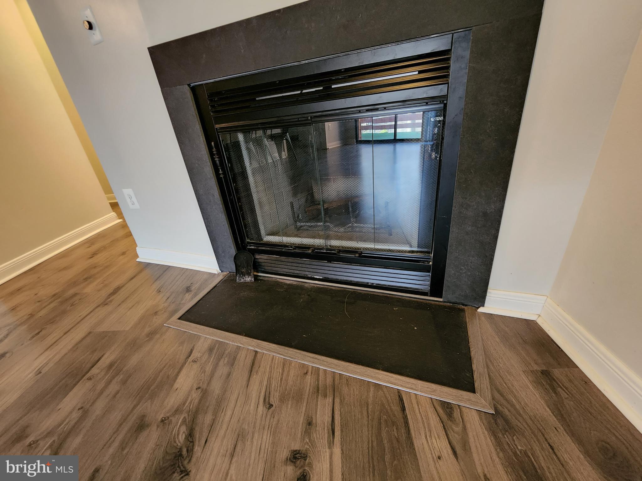 7603 Weather Worn Way, Unit F Columbia, MD 21046 - Photo 5 of 17 a view of a room with wooden floor and staircase