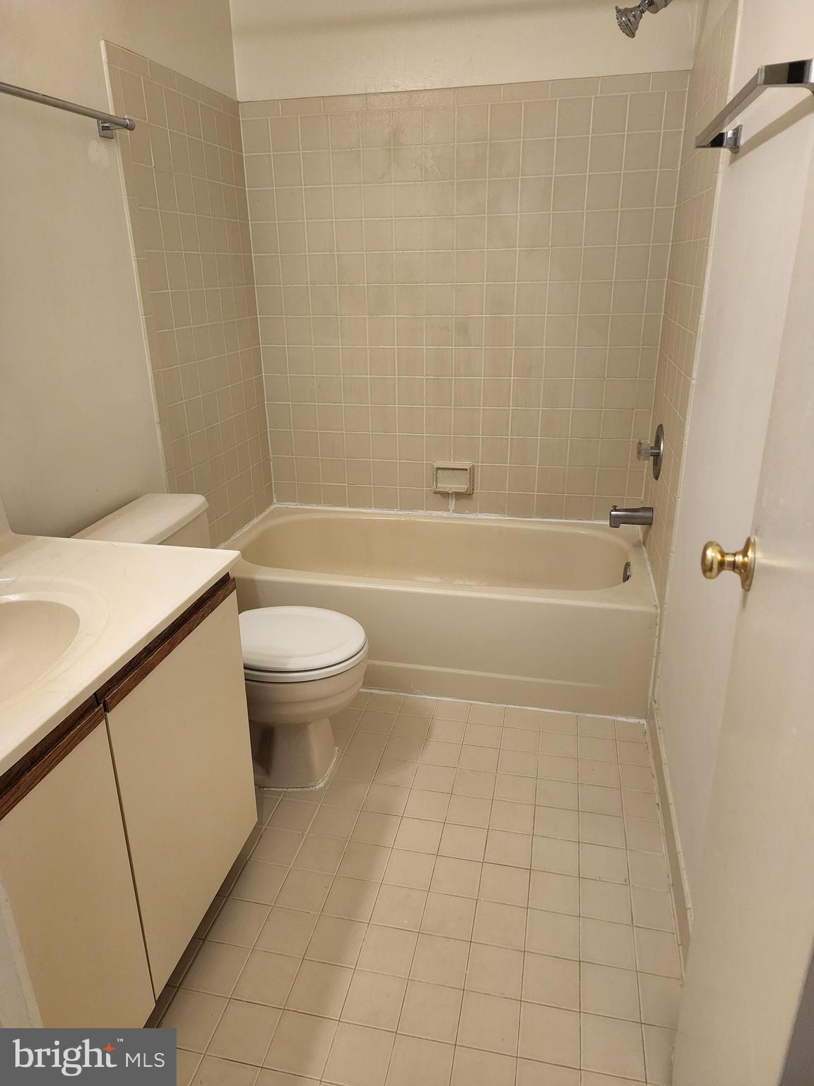 7603 Weather Worn Way, Unit F Columbia, MD 21046 - Photo 10 of 17 a bathroom with a sink a toilet and a shower