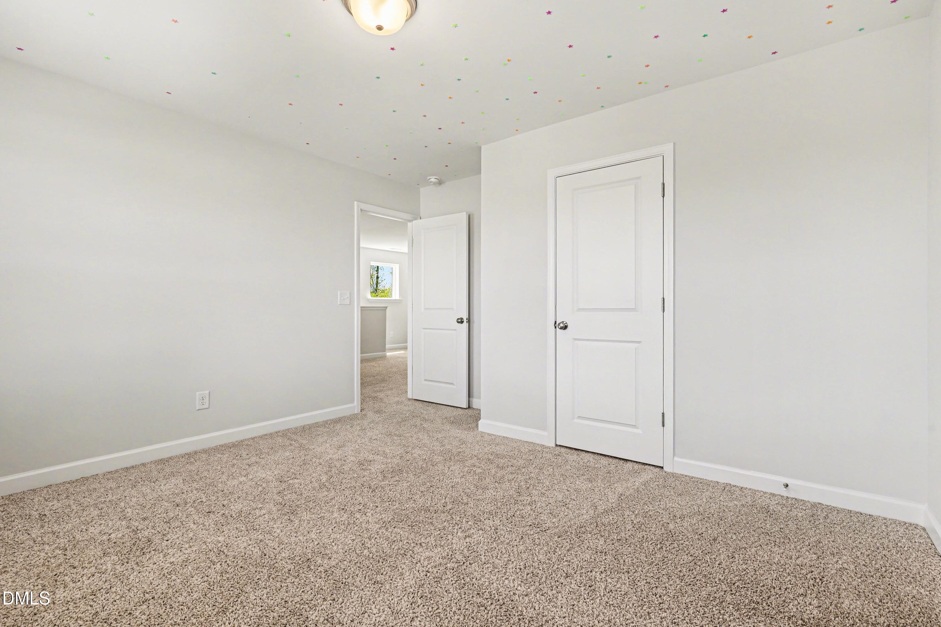 90 Rigsby Avenue Four Oaks, NC 27524 - Photo 26 of 43 an empty room with an entryway