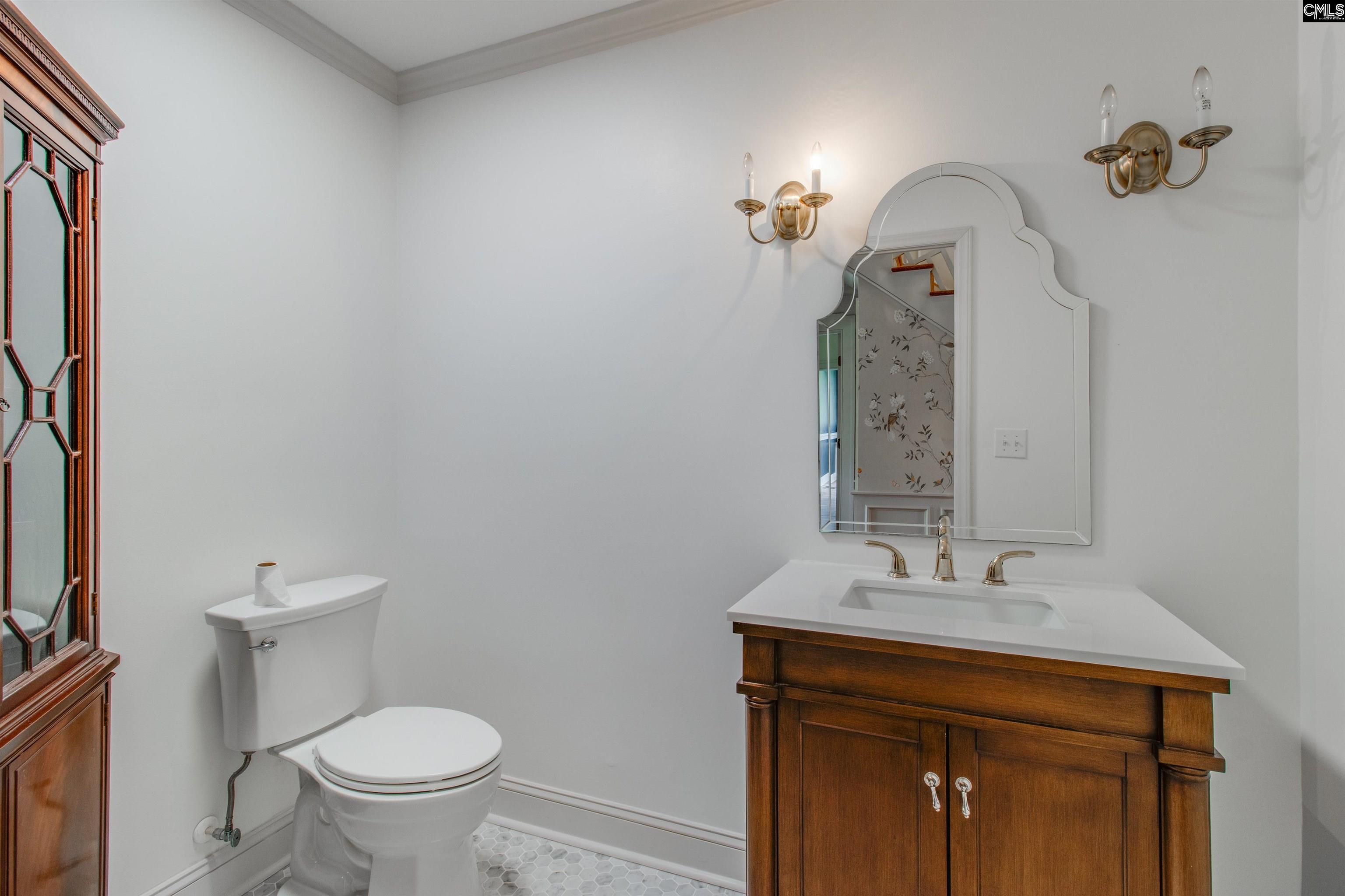 701 Longtown Road Columbia, SC 29229 - Photo 20 of 26 a bathroom with a sink a toilet and a mirror
