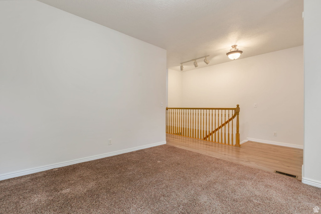 1092 Tithing Ridge Drive Riverton, UT 84065 - Photo 16 of 25 Expansive carpeted area with neutral wall tones
