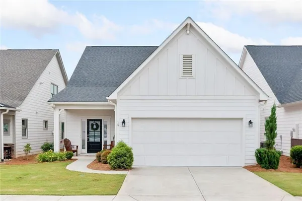 a front view of house with garage and yard