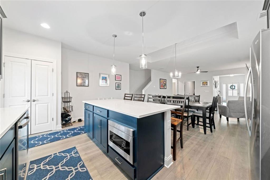 19 Grand Circle Jasper, GA 30143 - Photo 11 of 36 a kitchen with a sink a counter top space and stainless steel appliances
