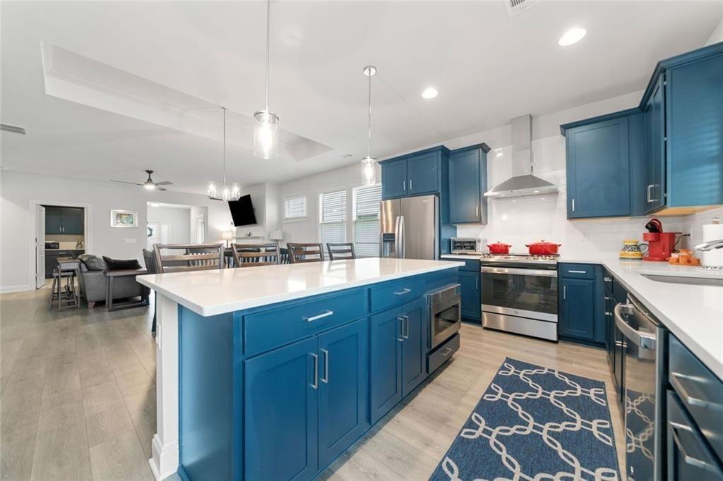 19 Grand Circle Jasper, GA 30143 - Photo 12 of 36 a kitchen with granite countertop a sink cabinets and stainless steel appliances