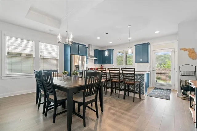 a view of a dining area with furniture window and wooden floor