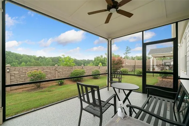 a view of a chairs and table in the balcony